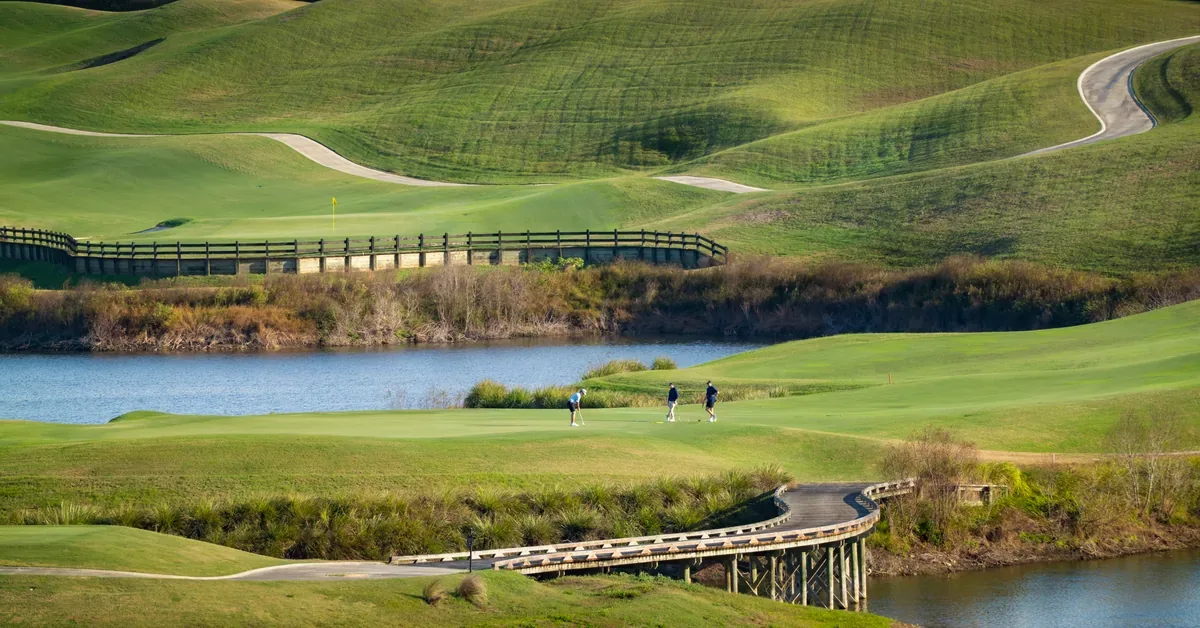 Feature Club At Iron Lake Golf Putting With Rolling Hills As Backdrop